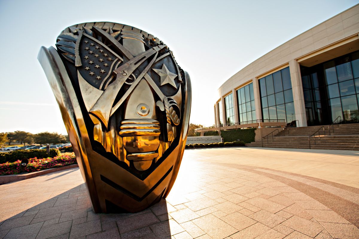 Close up of the Aggie Ring statue outside the Association of Former Students Building